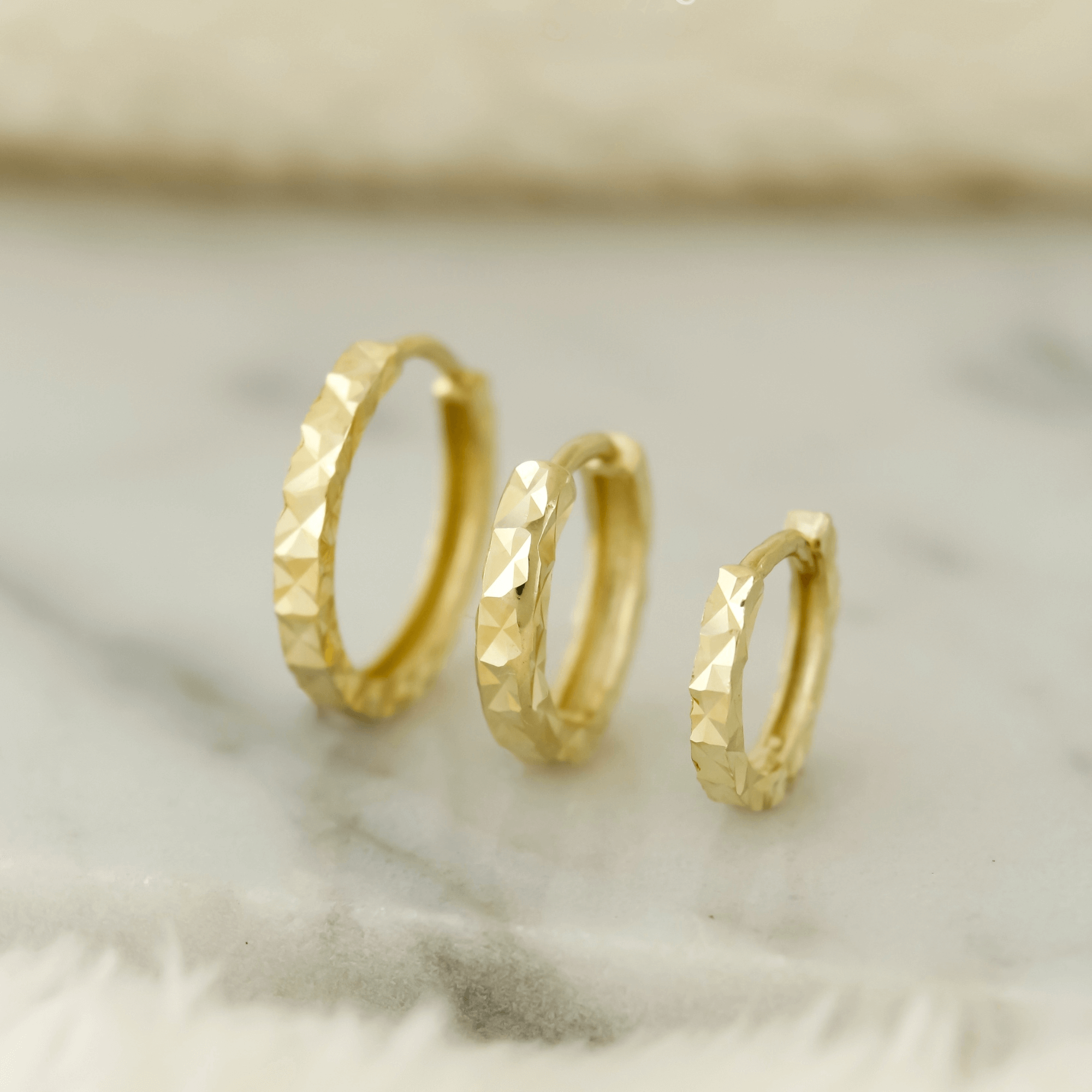 10k Solid Gold Diamond Cut Huggie Earrings - Serena Sparkles