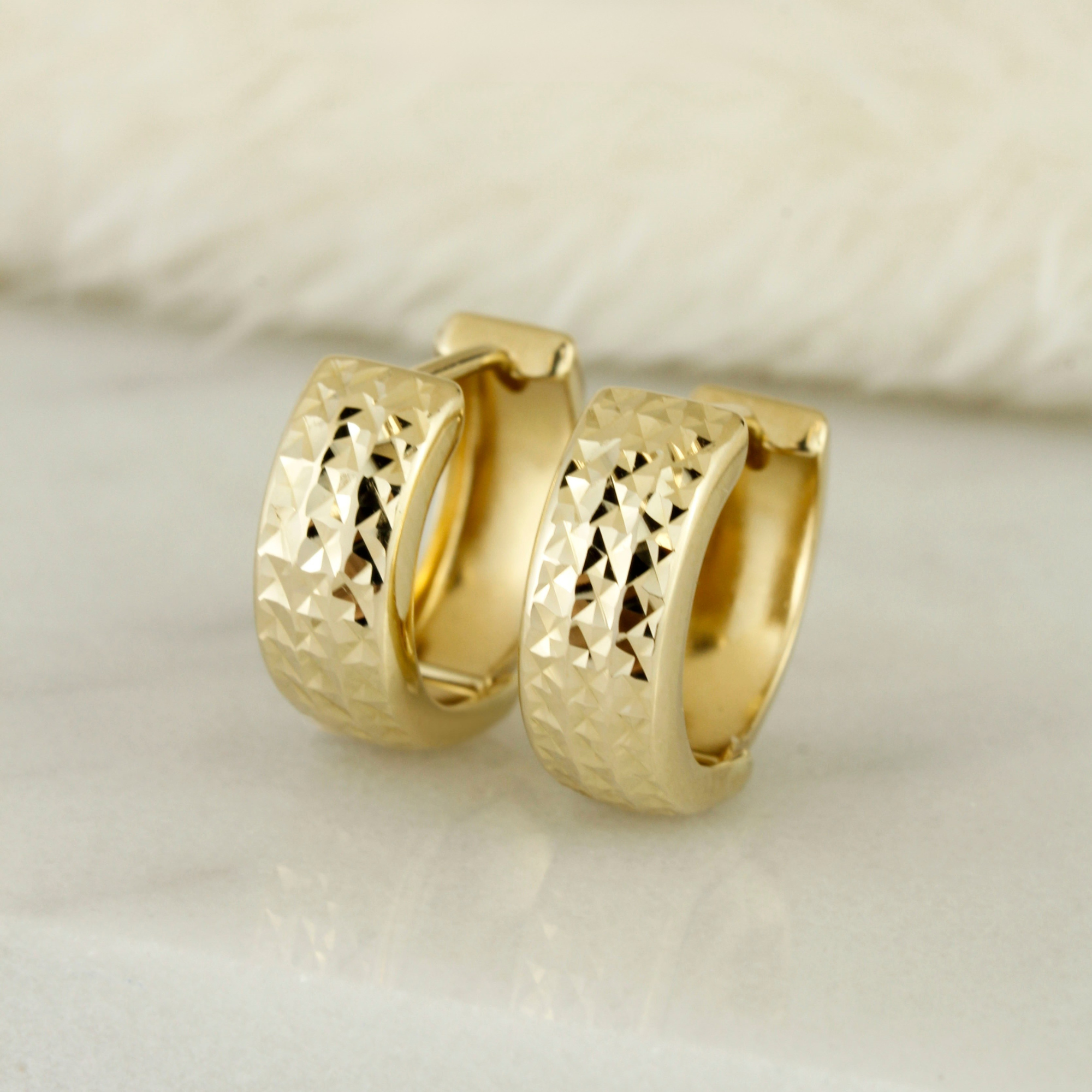 10k Solid Gold Diamond Cut Textured Huggie Earrings - Serena Sparkles