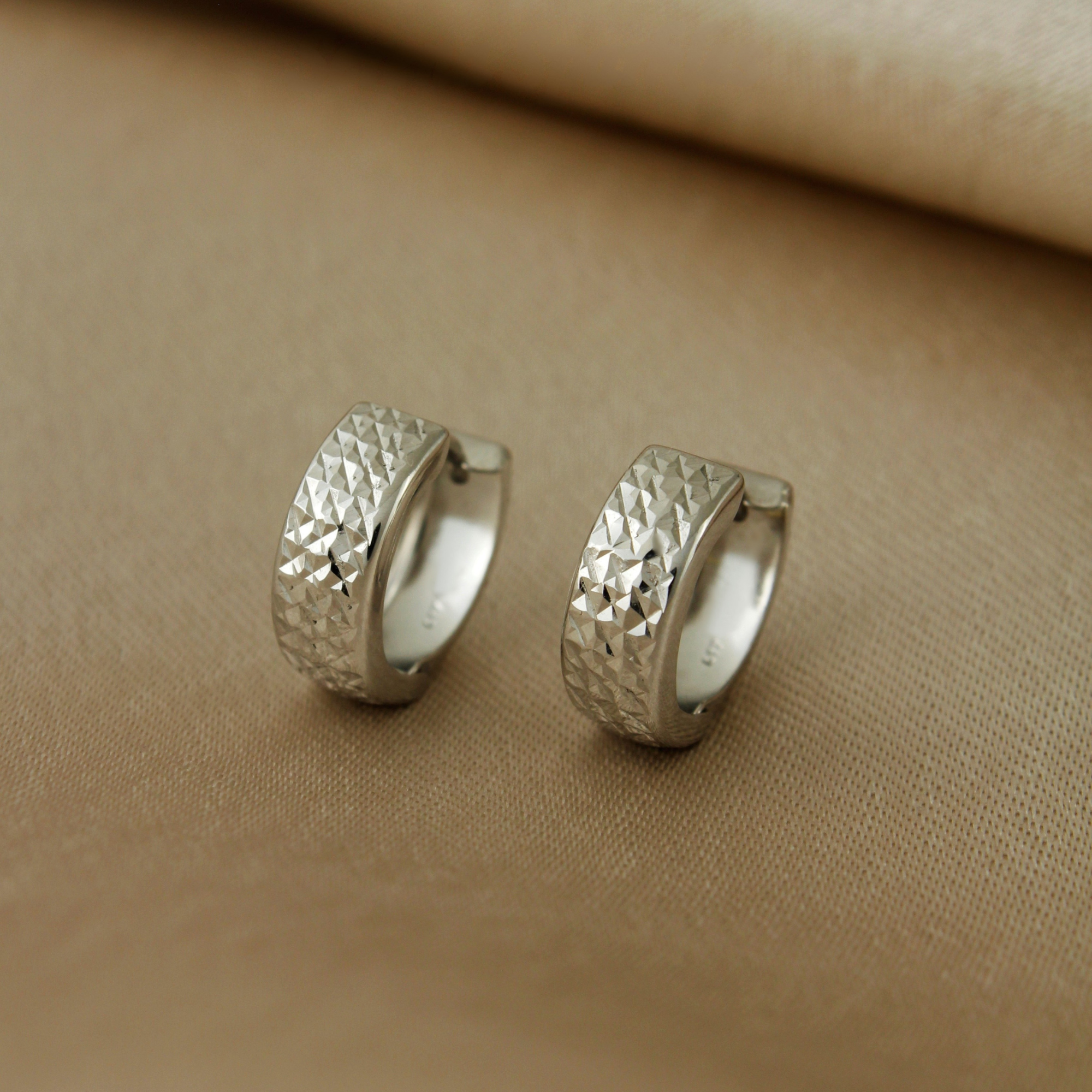 10k Solid White Gold Diamond Cut Textured Huggie Earrings - Serena Sparkles